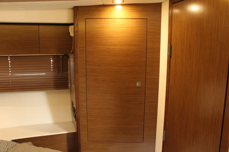 Slide: The Image of Interior of 2014 Cruisers Yachts 45 Cantius with wooden furnishings. - 42