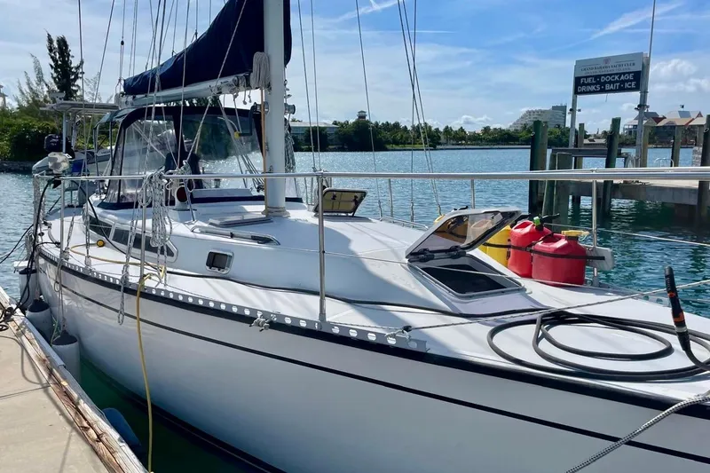 Slide: The Image of 1986 Gulfstar Hirsch 45 sailboat deck with fuel containers, docked at marina. - 4