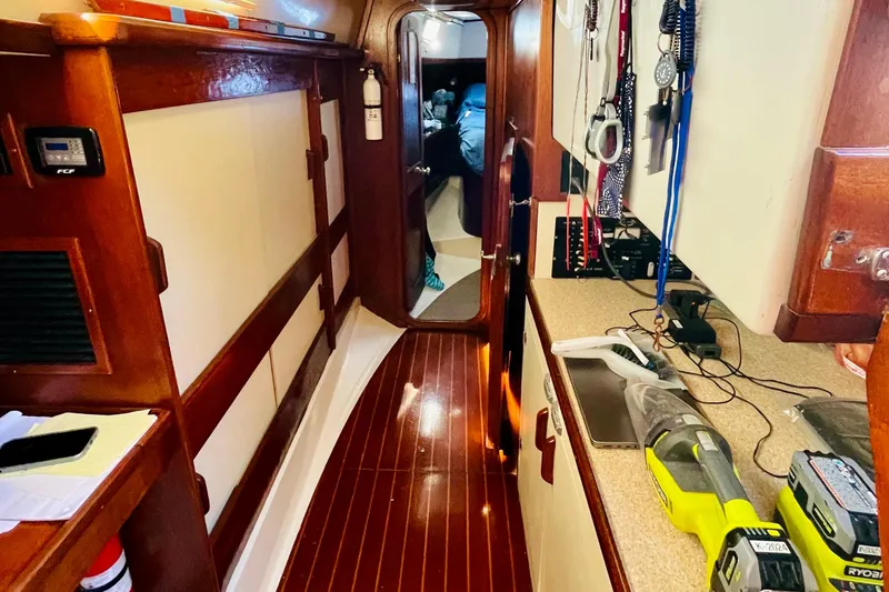 Slide: The Image of Cozy cabin interior of 1986 Gulfstar Hirsch 45 sailboat with wooden finishes. - 46