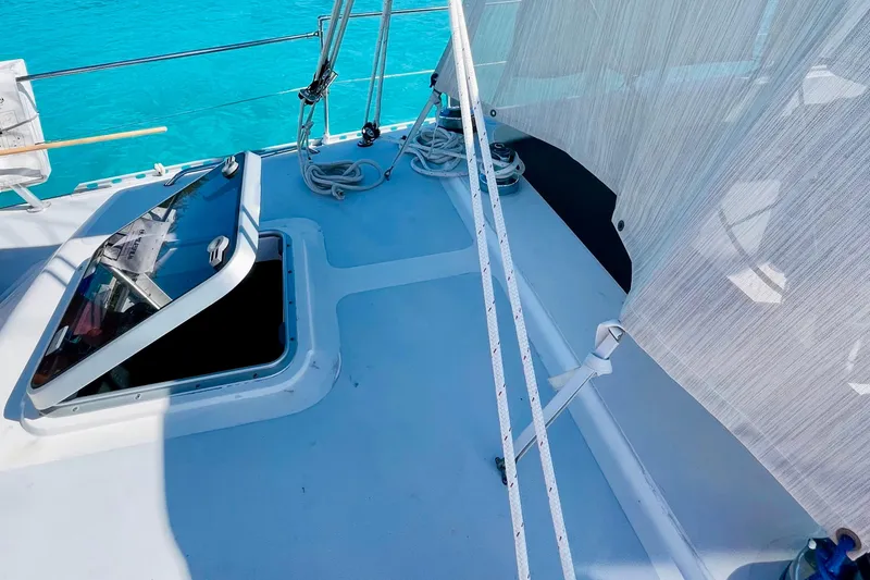 Slide: The Image of 1986 Gulfstar HIRSCH yacht deck with open hatch and clear blue water. - 13