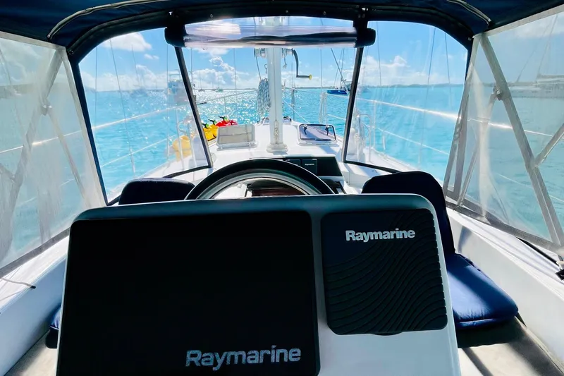 Slide: The Image of Cockpit view of 1986 Gulfstar HIRSCH sailboat with Raymarine equipment, sailing on clear blue waters. - 15