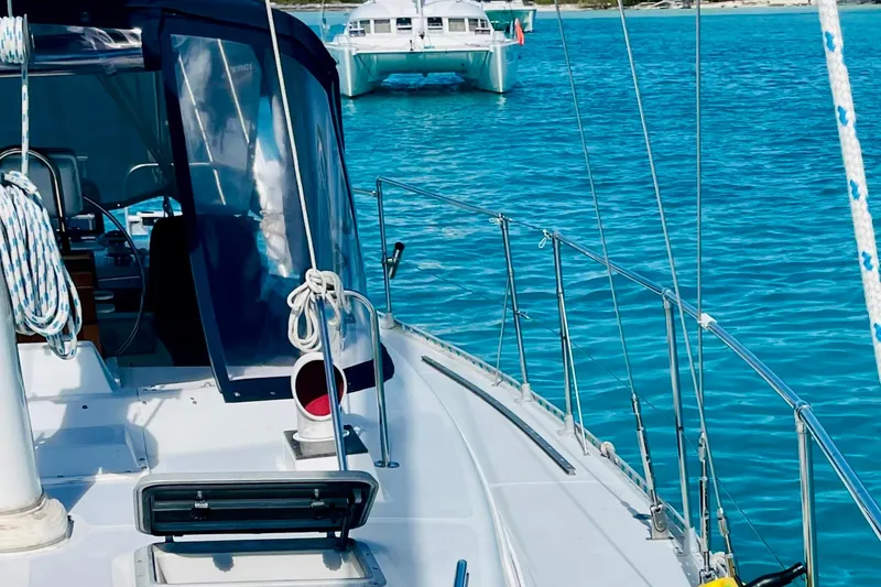 Slide: The Image of Sailboat deck view with Gulfstar HIRSCH 1986, turquoise water, and distant catamaran. - 16