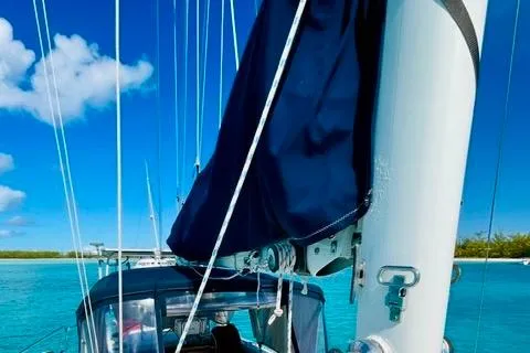 Slide: The Image of Sailboat "Gulfstar HIRSCH 1986" on turquoise waters under a clear blue sky. - 22