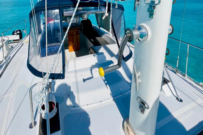 Slide: The Image of 1986 Gulfstar HIRSCH sailboat deck with clear blue water background. - 23