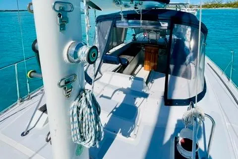 Slide: The Image of 1986 Gulfstar HIRSCH sailboat on turquoise water, featuring deck and cockpit view. - 24