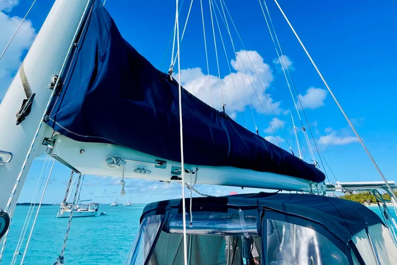 Slide: The Image of 1986 Gulfstar HIRSCH sailboat with blue sail cover on a sunny day. - 33