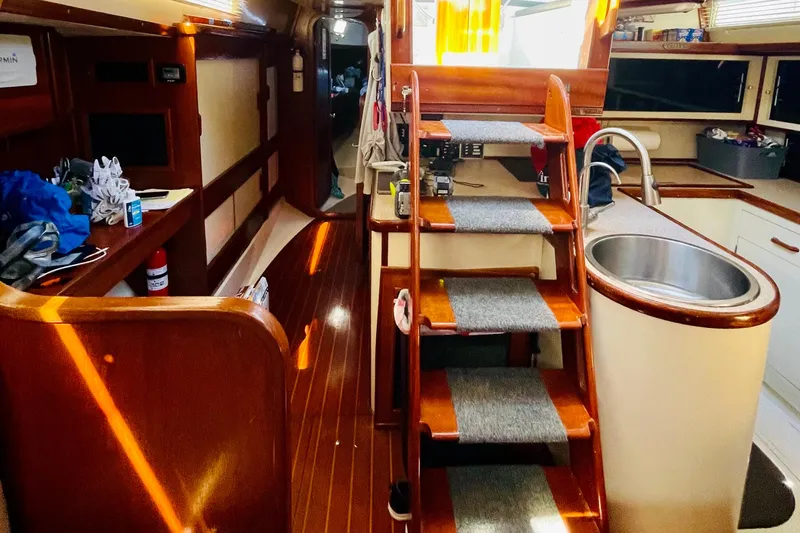Slide: The Image of Interior of 1986 Gulfstar HIRSCH yacht with wooden flooring and compact kitchen area. - 41