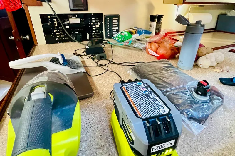 Slide: The Image of 1986 Gulfstar HIRSCH interior with kitchen counter, appliances, and food items. - 47