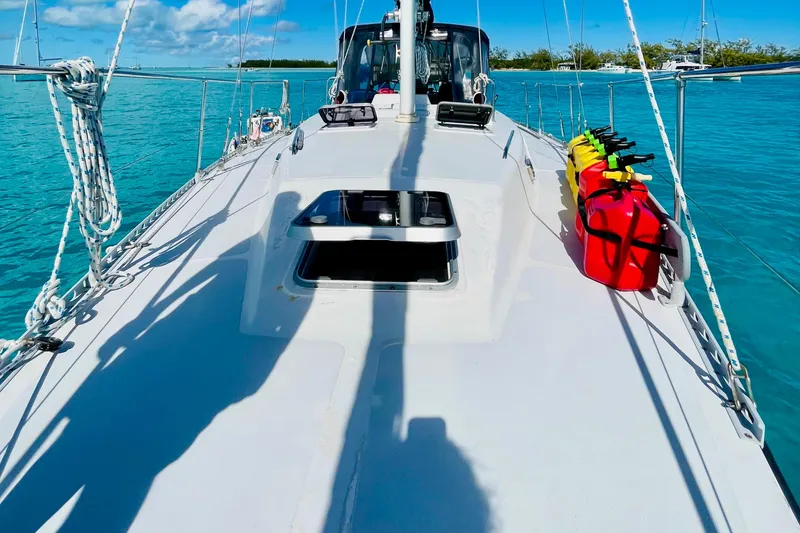 Slide: The Image of Sailboat deck view, Gulfstar HIRSCH 1986, with fuel cans, on clear blue water. - 5