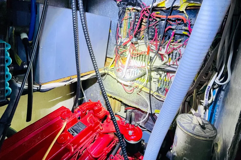 Slide: The Image of Engine room of 1986 Gulfstar HIRSCH with red engine and complex wiring. - 52