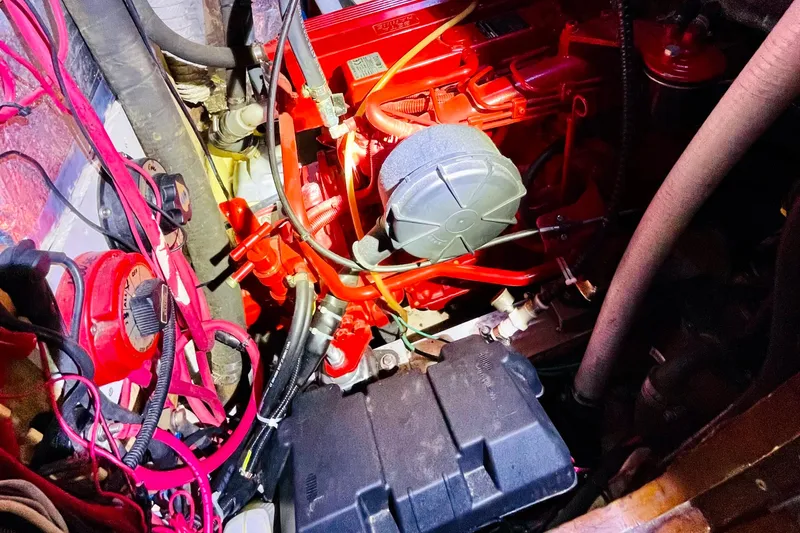 Slide: The Image of Engine compartment of a 1986 Gulfstar HIRSCH, featuring red components and wiring. - 56