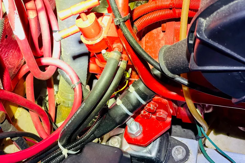 Slide: The Image of Close-up of 1986 Gulfstar HIRSCH engine components with red and black hoses. - 59