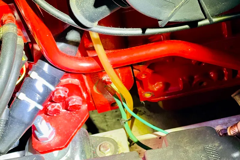 Slide: The Image of Close-up of 1986 Gulfstar HIRSCH engine components with red and black wiring. - 61