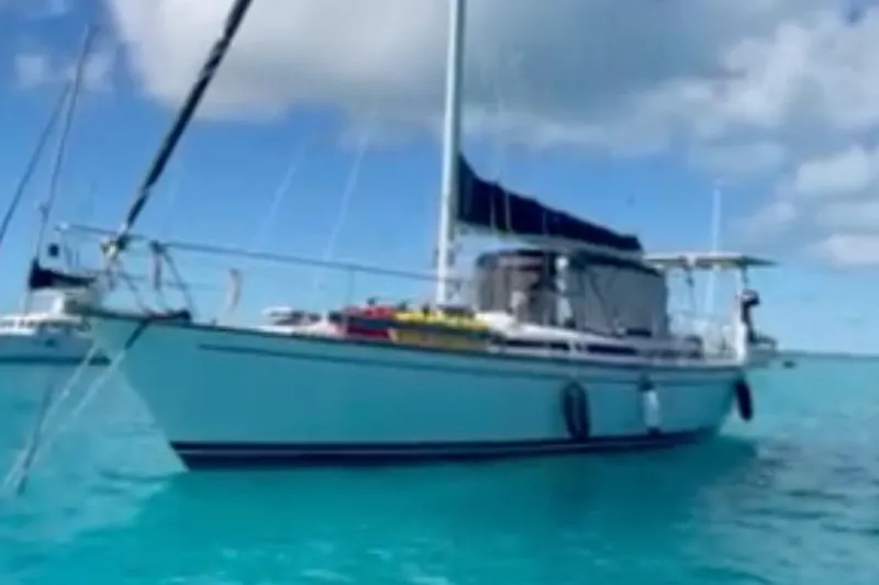 Slide: The Image of 1986 Gulfstar HIRSCH sailboat on clear turquoise water under a blue sky. - 65