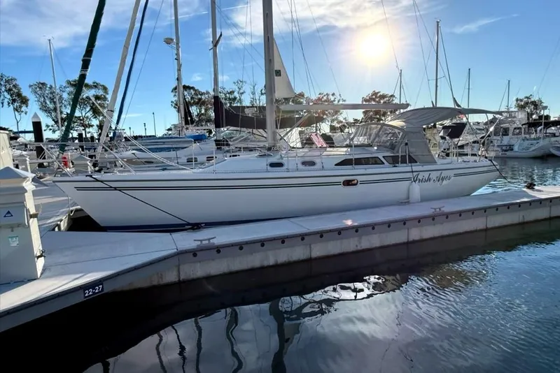 The Image of 2004 Catalina 36 MkII sailboat docked at marina under sunny sky. - 0