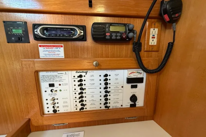Slide: The Image of Electrical panel of a 2004 Catalina 36 MkII yacht with radio and controls. - 12