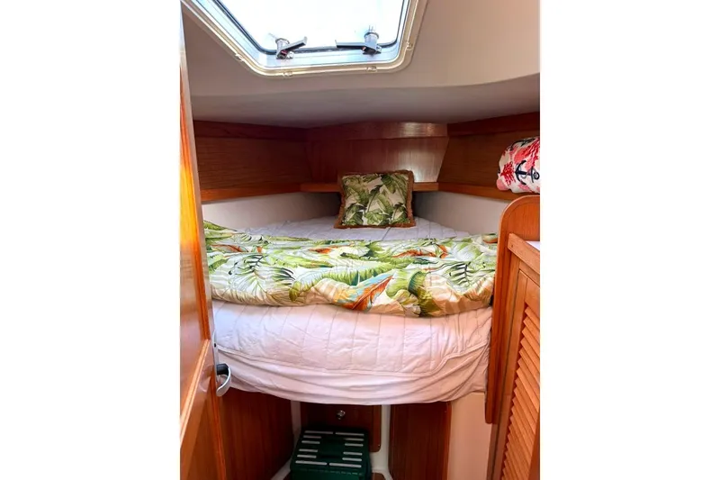 Slide: The Image of Cozy cabin interior of 2004 Catalina 36 MkII sailboat with tropical bedding. - 14