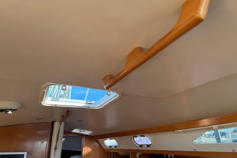 Slide: The Image of Interior view of 2004 Catalina 36 MkII sailboat with wooden trim and skylight. - 18