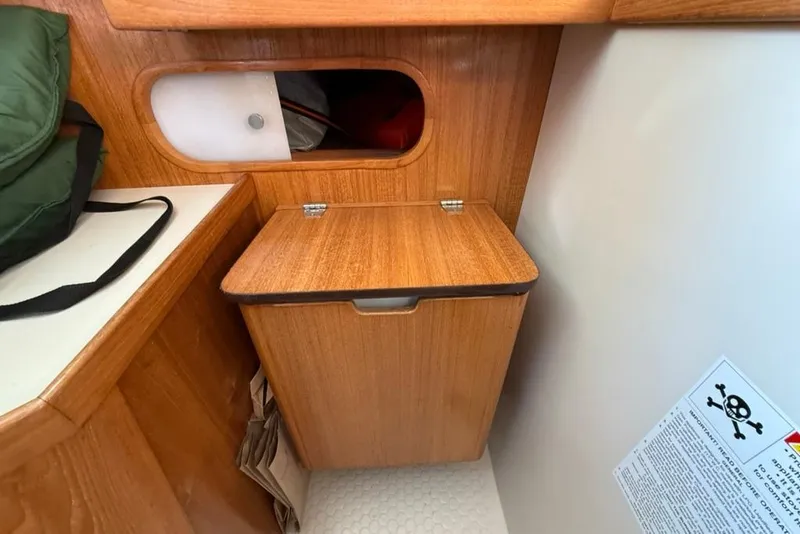 Slide: The Image of Wooden interior of 2004 Catalina 36 MkII sailboat with storage compartment. - 27
