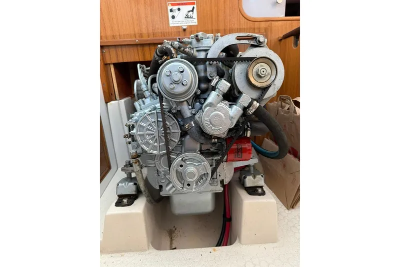 Slide: The Image of Engine of a 2004 Catalina 36 MkII sailboat, showcasing mechanical components. - 28