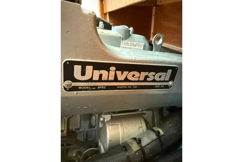 Slide: The Image of Engine label of a 2004 Catalina 36 MkII sailboat, featuring Universal branding. - 31