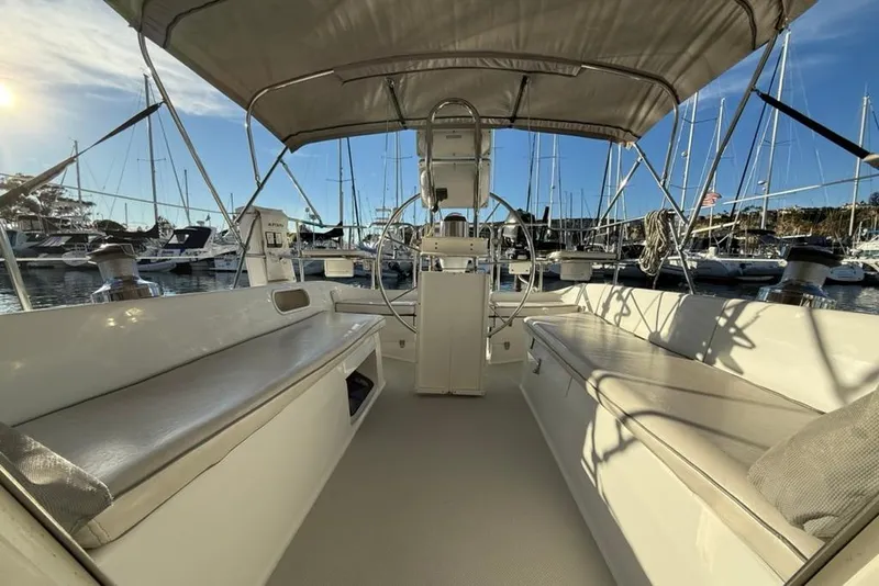 Slide: The Image of 2004 Catalina 36 MkII sailboat interior with seating, docked in a marina. - 32