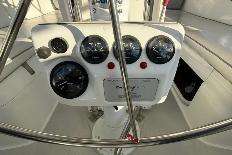 Slide: The Image of Control panel of a 2004 Catalina 36 MkII yacht with gauges and steering wheel. - 35