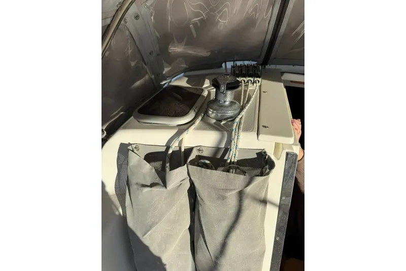 Slide: The Image of 2004 Catalina 36 MkII sailboat cockpit with winch and rope storage. - 37