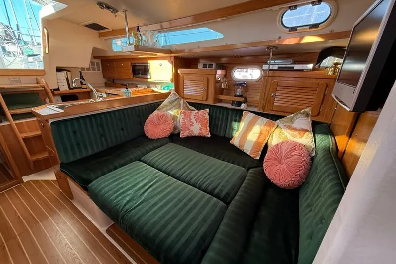 Slide: The Image of Interior of 2004 Catalina 36 MkII sailboat with cozy seating and wooden finishes. - 4