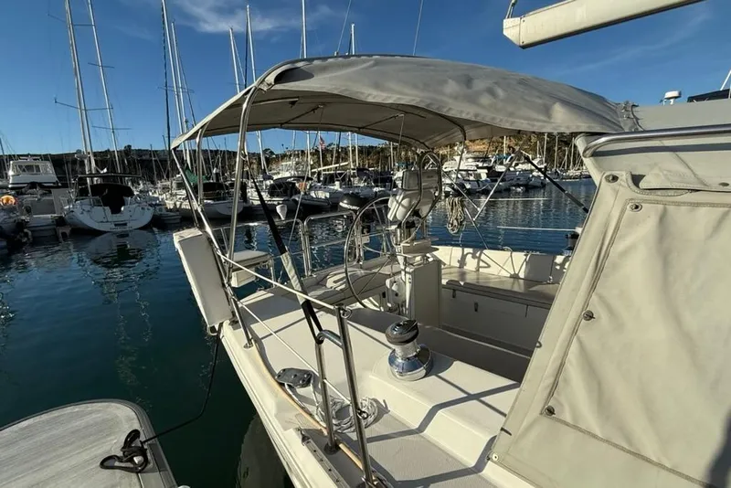 Slide: The Image of 2004 Catalina 36 MkII sailboat docked in a marina under clear blue skies. - 43