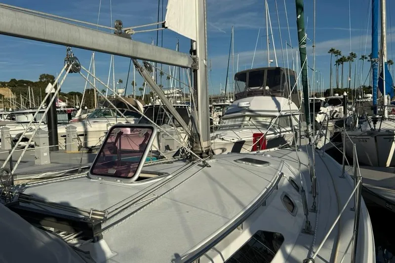 Slide: The Image of 2004 Catalina 36 MkII sailboat docked at a marina under clear skies. - 45