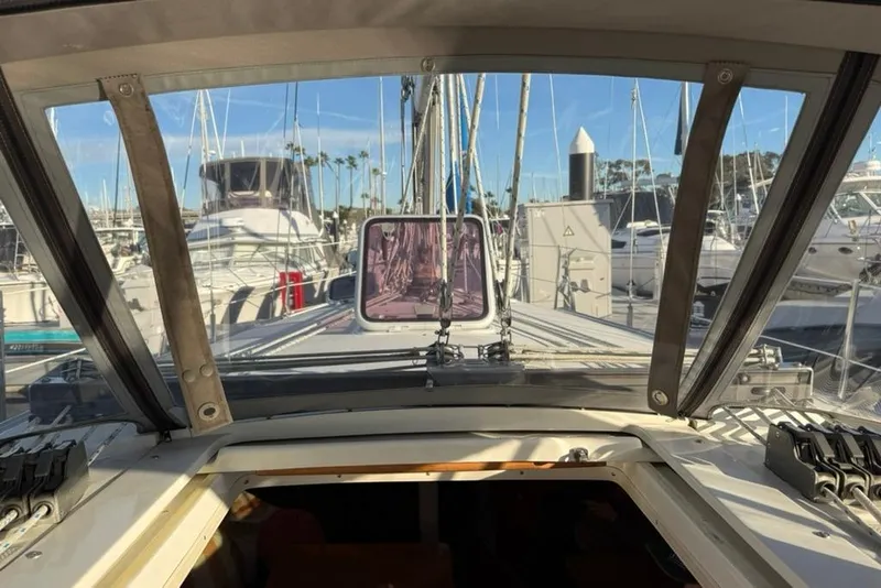 Slide: The Image of View from the cockpit of a 2004 Catalina 36 MkII sailboat in a marina. - 48