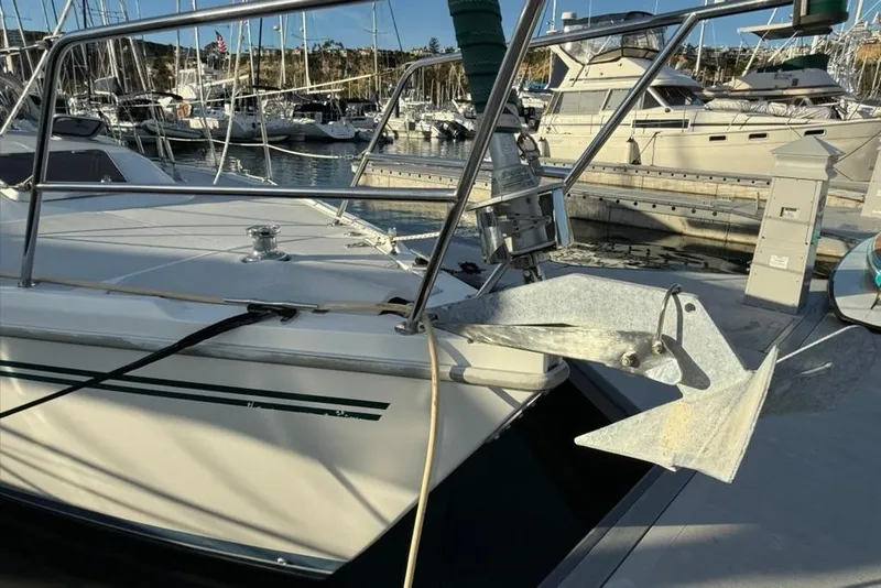 Slide: The Image of Catalina 36 MkII 2004 sailboat anchored at marina, featuring a prominent anchor. - 50