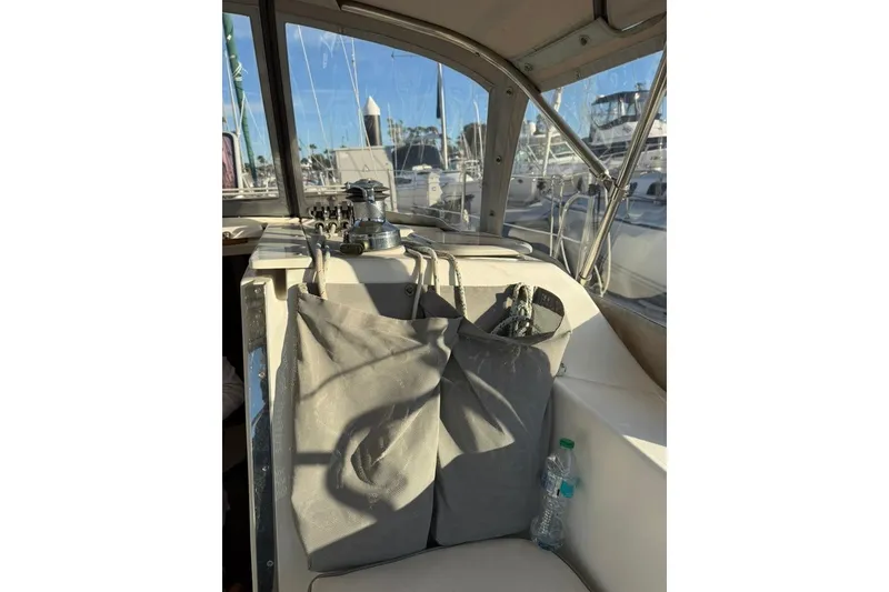 Slide: The Image of Interior of a 2004 Catalina 36 MkII sailboat with storage bags and winch. - 52