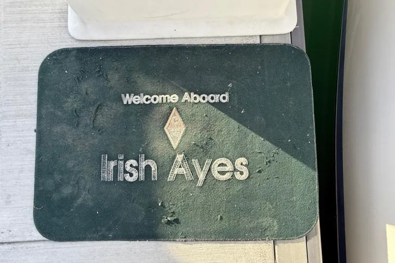 Slide: The Image of Welcome mat on Catalina 36 MkII, 2004, with "Irish Ayes" inscription. - 55