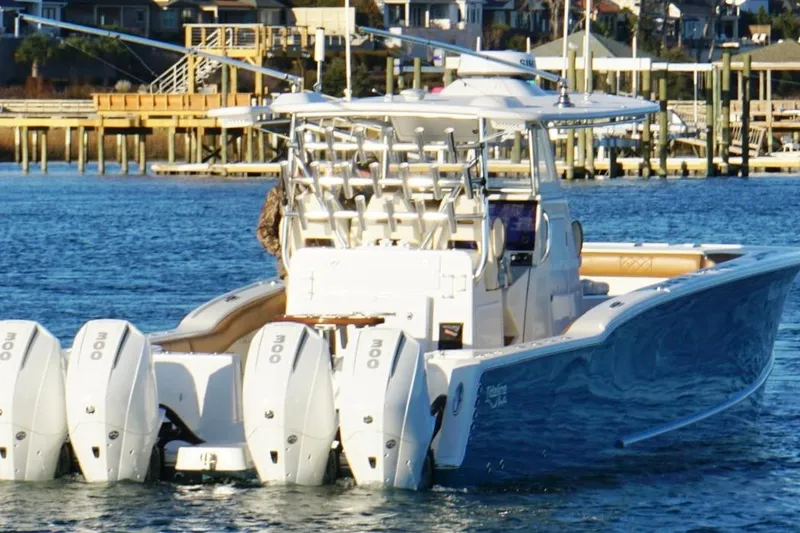 Slide: The Image of 2022 Tideline 365 Offshore boat with multiple engines on a calm waterway. - 10