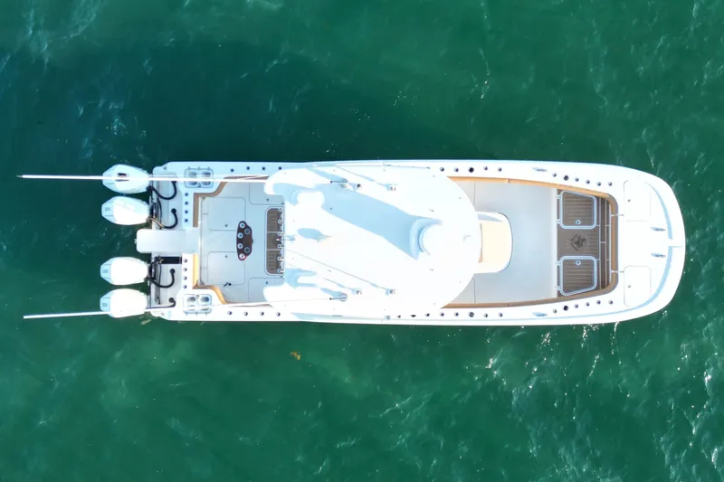 Slide: The Image of Aerial view of 2022 Tideline 365 Offshore boat on green water. - 14