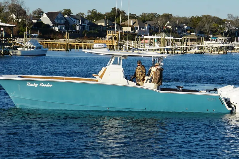 Slide: The Image of 2022 Tideline 365 Offshore boat cruising on calm blue water. - 4