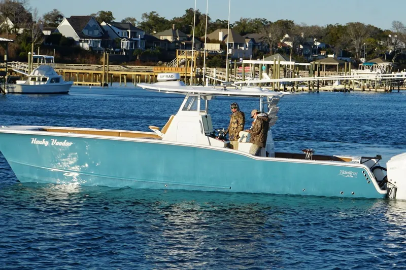 Slide: The Image of 2022 Tideline 365 Offshore boat on water near docks and houses. - 7