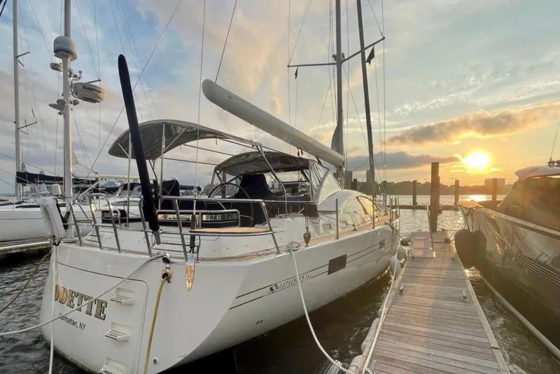 Slide: The Image of Sailing yacht Southerly 57 RS, 2010 model, docked at sunset. - 2