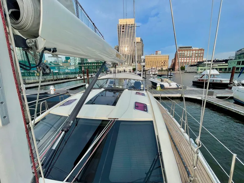 Slide: The Image of 2010 Southerly 57 RS sailboat docked, cityscape in background. - 20