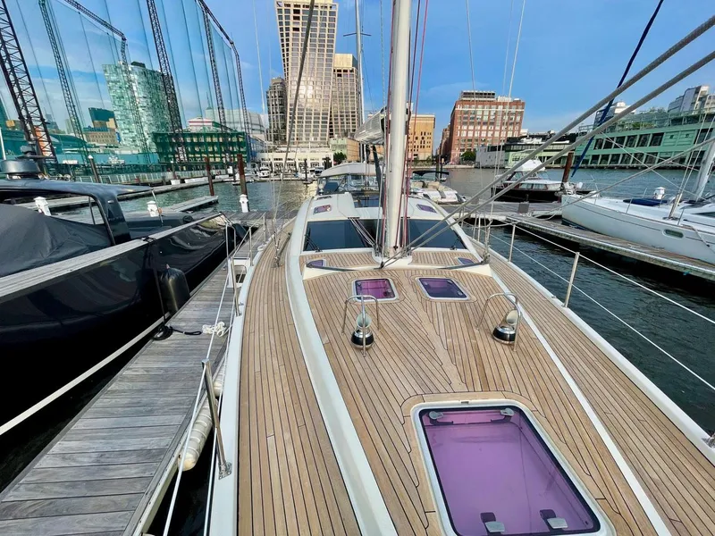 Slide: The Image of 2010 Southerly 57 RS yacht docked, modern architecture in background. - 26