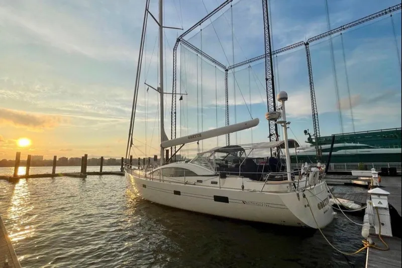 Slide: The Image of Sailing yacht Southerly 57 RS 2010 docked at sunset, serene waterfront view. - 4