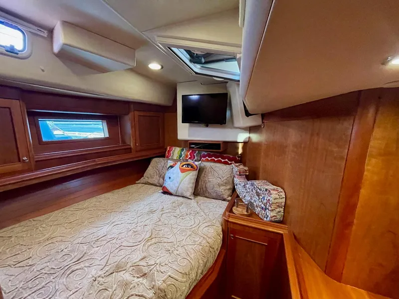 Slide: The Image of Interior of a 2010 Southerly 57 RS yacht featuring a cozy bedroom. - 45