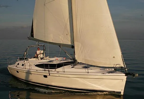The Image of 2009 Hunter 50 Center Cockpit sailboat docked at marina, side view. - 0