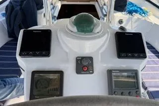 Slide: The Image of 2009 Hunter 50 Center Cockpit helm with navigation instruments and compass. - 10