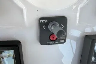 Slide: The Image of Control panel of a 2009 Hunter 50 Center Cockpit boat thruster system. - 11