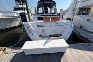 Slide: The Image of 2009 Hunter 50 Center Cockpit yacht docked at marina, rear view. - 15