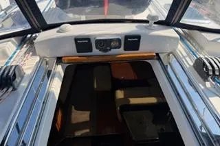 Slide: The Image of 2009 Hunter 50 Center Cockpit interior view with navigation equipment and seating area. - 18