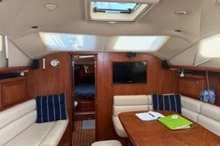 Slide: The Image of Interior of 2009 Hunter 50 Center Cockpit yacht with seating and table. - 19